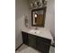 Bathroom with a modern vanity, neutral walls, and tiled floors creating a spa-like atmosphere at 11506 Hidden Bay, Indianapolis, IN 46236