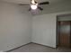 Neutral bedroom with a ceiling fan and a dark wooden door at 11506 Hidden Bay, Indianapolis, IN 46236
