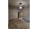 Neutral bedroom features a ceiling fan, carpet, and wood trim at 11506 Hidden Bay, Indianapolis, IN 46236