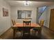 Well lit dining room with hard wood floors and pass through to the kitchen at 11506 Hidden Bay, Indianapolis, IN 46236
