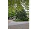 This home is located on a corner lot with mature trees and greenery at 11506 Hidden Bay, Indianapolis, IN 46236