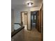 Upstairs hallway with neutral carpet and trim leads to bathroom and bedrooms at 11506 Hidden Bay, Indianapolis, IN 46236