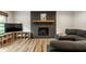 Cozy basement with gray sectional sofa and modern fireplace with decor at 1240 E 56Th St, Indianapolis, IN 46220