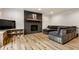 Modern basement with cozy seating area, fireplace, and stylish decor at 1240 E 56Th St, Indianapolis, IN 46220