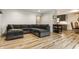 Modern basement with a gray sectional and fireplace, with open floor plan at 1240 E 56Th St, Indianapolis, IN 46220