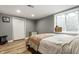 Comfortable bedroom with a natural light, hardwood floors, and closet at 1240 E 56Th St, Indianapolis, IN 46220