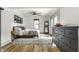 Serene bedroom with natural light, wooden floors, area rug, and chic furnishings, offering a peaceful retreat at 1240 E 56Th St, Indianapolis, IN 46220