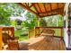 Inviting outdoor seating area with wooden railing and scenic views of lush greenery at 1240 E 56Th St, Indianapolis, IN 46220