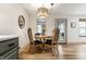 Cozy dining area featuring a wood table, decorative mirror, and stylish light fixture, perfect for intimate meals at 1240 E 56Th St, Indianapolis, IN 46220