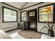 Stylish entryway featuring a dark front door, neutral walls, and modern decor at 1240 E 56Th St, Indianapolis, IN 46220