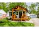 Charming exterior view of home featuring a covered porch and landscaped yard at 1240 E 56Th St, Indianapolis, IN 46220