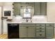 Well-lit kitchen featuring sleek countertops, stainless steel sink, gray cabinets, and contemporary fixtures at 1240 E 56Th St, Indianapolis, IN 46220