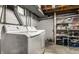 Practical laundry room with modern appliances, shelving, and good ventilation for efficient chore management at 1240 E 56Th St, Indianapolis, IN 46220