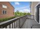 Relaxing outdoor balcony with wood flooring and railing, offering a view of the surrounding area at 13094 Overview Dr # 5D, Fishers, IN 46037