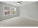 Minimalist bedroom with two windows, neutral carpet, and freshly painted walls, ready for personalization at 13094 Overview Dr # 5D, Fishers, IN 46037