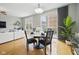Bright dining area with a modern table, seating for four, and sliding glass doors to the outside at 13094 Overview Dr # 5D, Fishers, IN 46037