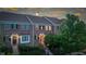 Charming brick townhome with manicured landscaping, covered entry, and welcoming front door at 13094 Overview Dr # 5D, Fishers, IN 46037