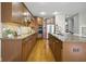 Open kitchen featuring a large island, stainless steel appliances, and hardwood floors at 13094 Overview Dr # 5D, Fishers, IN 46037