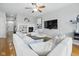 Comfortable living room with a fireplace, large sectional sofa, and plenty of natural light at 13094 Overview Dr # 5D, Fishers, IN 46037