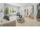 Inviting living room featuring a large window, neutral decor, and carpeted floors at 13094 Overview Dr # 5D, Fishers, IN 46037