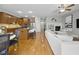 Open-concept living space with kitchen island, dining area, and fireplace, perfect for entertaining at 13094 Overview Dr # 5D, Fishers, IN 46037