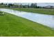 Exterior shot of a landscaped lawn and pond that backs up to the property at 14058 Southwood Cir, Fishers, IN 46037