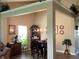 A dining room featuring elegant décor, a wooden table set, and an open layout connected to other living spaces at 14058 Southwood Cir, Fishers, IN 46037
