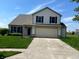 Charming two-story home featuring a well-manicured lawn, attached two-car garage, and lovely curb appeal at 14058 Southwood Cir, Fishers, IN 46037