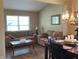 A cozy living room with hardwood floors, neutral walls, comfortable sofas, and a bright, inviting atmosphere at 14058 Southwood Cir, Fishers, IN 46037