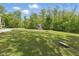 Expansive backyard featuring a lush green lawn and a charming playhouse at 1490 N County Road 50 E, Danville, IN 46122