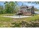 Backyard view with pool, landscaping, and stairs leading to the raised deck at 1490 N County Road 50 E, Danville, IN 46122
