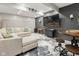 Finished basement features a sectional sofa, mounted television, and modern touches at 1490 N County Road 50 E, Danville, IN 46122