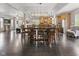 Open-concept dining area with hardwood floors connects to a modern kitchen and cozy living area with lots of natural light at 1490 N County Road 50 E, Danville, IN 46122