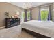 Comfortable main bedroom with large windows, carpet flooring, and cozy fireplace; a relaxing retreat at 1490 N County Road 50 E, Danville, IN 46122