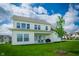 Spacious backyard showcasing a new home with a covered patio and a barbecue grill perfect for outdoor living at 15792 Wiseman Dr, Fishers, IN 46040