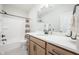 Bright bathroom featuring a wooden vanity, ample counter space, and a shower and tub combo at 15792 Wiseman Dr, Fishers, IN 46040