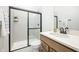 Modern bathroom with a tiled shower and elegant vanity with granite countertop at 15792 Wiseman Dr, Fishers, IN 46040