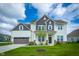 Charming two-story home with a well-manicured lawn and attached two car garage at 15792 Wiseman Dr, Fishers, IN 46040