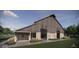 Exterior view of a modern barn-style community recreation building with stone and metal siding at 15792 Wiseman Dr, Fishers, IN 46040