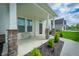 Welcoming front porch with stone pillars, green landscaping, and a clear view of the neighborhood at 15792 Wiseman Dr, Fishers, IN 46040