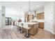 Open-concept kitchen and dining area with a kitchen island and stainless steel appliances at 15792 Wiseman Dr, Fishers, IN 46040
