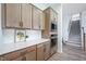 Bright kitchen with custom cabinets, white countertops, and stainless steel microwave at 15792 Wiseman Dr, Fishers, IN 46040