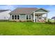 Expansive backyard features lush lawn, patio with seating, and well-maintained landscaping at 16270 Northwind Ct, Westfield, IN 46074