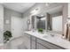 Well-lit bathroom featuring double sinks, quartz countertops, and modern fixtures, providing a clean and functional space at 16270 Northwind Ct, Westfield, IN 46074