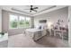 Inviting bedroom with tray ceilings, large window, and carpet flooring, creating a serene and comfortable atmosphere at 16270 Northwind Ct, Westfield, IN 46074