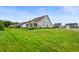 Spacious front lawn showcases a well-maintained yard and charming neighborhood setting at 16270 Northwind Ct, Westfield, IN 46074