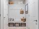 Charming mudroom offers built-in bench with storage, perfect for organizing shoes and bags at 16270 Northwind Ct, Westfield, IN 46074