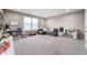 Spacious playroom with plush carpet, bright window, and plenty of space for toys and activities at 16270 Northwind Ct, Westfield, IN 46074