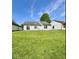 Expansive backyard with lush green grass, offering plenty of room for recreation and outdoor enjoyment at 1639 Park Castle Way, Indianapolis, IN 46229