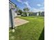 Spacious backyard with a well-maintained lawn, offering ample space for outdoor activities and relaxation at 1639 Park Castle Way, Indianapolis, IN 46229